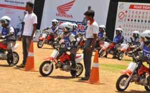 a rippon CRF 50 Motorcycles educating kids on safe riding at Honda CRF50 Fest